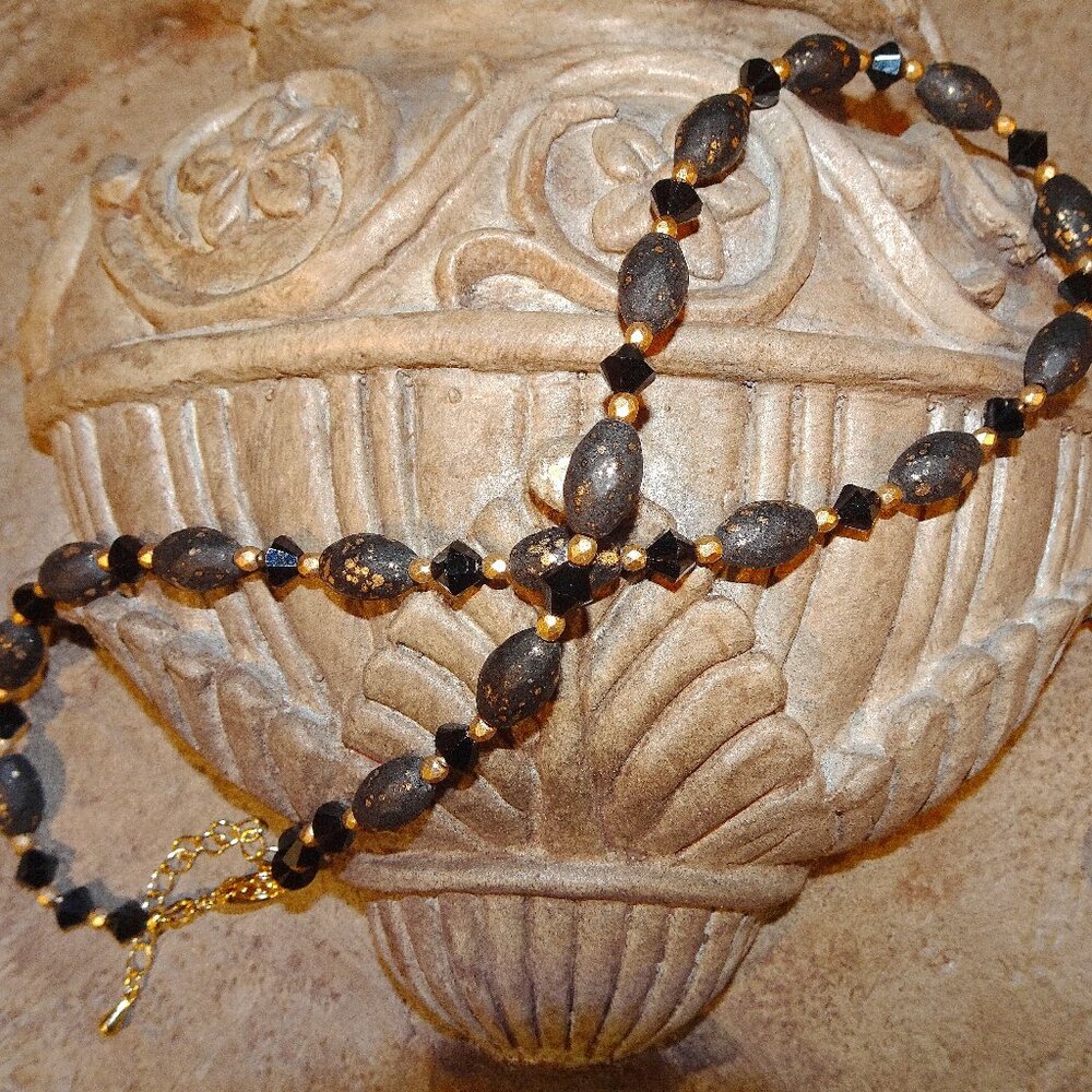 Handmade necklace/earring set in black with gold accents